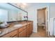 Bathroom featuring a granite countertop, vanity, and tiled shower room at 100 Bluff View Dr # 405C, Belleair Bluffs, FL 33770