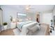 Spacious main bedroom with king bed, ceiling fan and en-suite bathroom at 100 Bluff View Dr # 405C, Belleair Bluffs, FL 33770