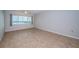 Bedroom with tile floors, ceiling fan, and water view at 100 Bluff View Dr # 405C, Belleair Bluffs, FL 33770