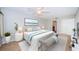Spacious bedroom with large bed and water view at 100 Bluff View Dr # 405C, Belleair Bluffs, FL 33770