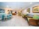 Bright community room offering gathering spaces with seating and decor at 100 Bluff View Dr # 405C, Belleair Bluffs, FL 33770