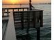 Tranquil sunset view from the fishing pier, complete with a young boy with rod and reel at 100 Bluff View Dr # 405C, Belleair Bluffs, FL 33770