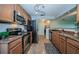 Well-equipped kitchen with granite countertops, stainless steel appliances, tile flooring, and ample cabinetry at 100 Bluff View Dr # 405C, Belleair Bluffs, FL 33770