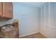 Efficient kitchen space with tan countertops, white pantry, and wooden cabinets at 100 Bluff View Dr # 405C, Belleair Bluffs, FL 33770