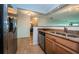 Modern kitchen featuring stainless steel appliances, granite countertops and a pass-through to the other room at 100 Bluff View Dr # 405C, Belleair Bluffs, FL 33770
