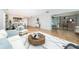 Stylish living room with tile floors, modern furniture, and an open layout to dining at 100 Bluff View Dr # 405C, Belleair Bluffs, FL 33770