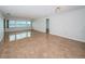 Bright living room featuring tile floors and expansive windows offering stunning water views at 100 Bluff View Dr # 405C, Belleair Bluffs, FL 33770
