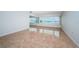 Bright living room featuring glossy tile flooring and expansive windows offering a scenic view at 100 Bluff View Dr # 405C, Belleair Bluffs, FL 33770