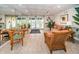 Inviting lobby with rattan furniture, bright lighting, and a neutral palette, creating a relaxing and welcoming atmosphere at 100 Bluff View Dr # 405C, Belleair Bluffs, FL 33770