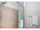 New shower with tiled walls, multiple shower heads and glass doors at 100 Bluff View Dr # 405C, Belleair Bluffs, FL 33770