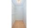 Walk-in closet featuring white wire shelving and tiled floors at 100 Bluff View Dr # 405C, Belleair Bluffs, FL 33770