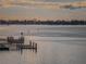 Picturesque water view showcases calm waters, and distant waterfront homes under a cloudy sky at 100 Bluff View Dr # 405C, Belleair Bluffs, FL 33770