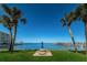 Waterfront picnic area with lush grass and palm trees at 100 Bluff View Dr # 405C, Belleair Bluffs, FL 33770