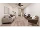 Bright living room with comfortable seating, neutral tones, and modern decor create an inviting space at 17860 Althea Blue Pl, Lutz, FL 33558