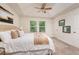 Beautiful bedroom featuring a neutral color palette, tray ceilings, and plush carpeting at 17860 Althea Blue Pl, Lutz, FL 33558