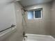 Clean bathroom with a tub, shower, and updated fixtures at 1840 Shore S Dr # 5, South Pasadena, FL 33707