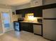 Updated kitchen with stainless steel appliances and dark cabinets at 1840 Shore S Dr # 5, South Pasadena, FL 33707