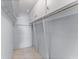 Spacious reach-in closet with double hanging rods and shelving at 1840 Shore S Dr # 5, South Pasadena, FL 33707