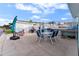 Outdoor patio with table, chairs, and grill at 1840 Shore S Dr # 5, South Pasadena, FL 33707