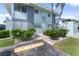 Building exterior, featuring landscaping and parking at 1840 Shore S Dr # 5, South Pasadena, FL 33707
