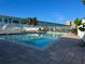Inviting community pool area with surrounding patio at 1840 Shore S Dr # 5, South Pasadena, FL 33707