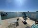 Stunning water view with patio furniture and a table at 1840 Shore S Dr # 5, South Pasadena, FL 33707