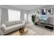 Living room with staged furniture and large window at 1840 Shore S Dr # 5, South Pasadena, FL 33707