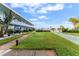 Lush lawn with shuffleboard courts and a pool at 1840 Shore S Dr # 5, South Pasadena, FL 33707