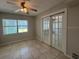 Spacious living area with tile floors and French doors leading outside at 1840 Shore S Dr # 5, South Pasadena, FL 33707