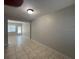 Open dining area with tile floors and access to other rooms at 1840 Shore S Dr # 5, South Pasadena, FL 33707
