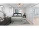 Bright bedroom with a queen bed, stylish decor, and access to a patio at 1840 Shore S Dr # 5, South Pasadena, FL 33707