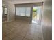 Living room with French doors and view of patio at 1840 Shore S Dr # 5, South Pasadena, FL 33707