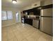 Bright kitchen with stainless steel appliances and an open floor plan at 1840 Shore S Dr # 5, South Pasadena, FL 33707