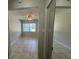 View of a bright living area with tile floors and access to other rooms at 1840 Shore S Dr # 5, South Pasadena, FL 33707