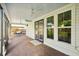 Relaxing screened porch with brick pavers and a swing at 307 E Gladys St, Tampa, FL 33602