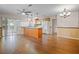 Kitchen and dining area with wood flooring and an island at 10534 Hardwood Ct, Port Richey, FL 34668