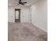 Bonus room with carpeted floor and multiple doors at 17860 Althea Blue Pl, Lutz, FL 33558