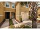 Front view of townhouse with garage and walkway at 17860 Althea Blue Pl, Lutz, FL 33558