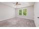 Bright bedroom with carpeted floor and two windows at 17860 Althea Blue Pl, Lutz, FL 33558