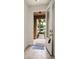 Interior view of entryway with open door and tiled floor at 17860 Althea Blue Pl, Lutz, FL 33558