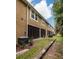Exterior view of building showcasing multiple screened patios at 17860 Althea Blue Pl, Lutz, FL 33558
