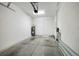 Attached garage with additional storage space at 17860 Althea Blue Pl, Lutz, FL 33558