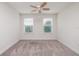 Bright bedroom featuring neutral decor and carpet at 17860 Althea Blue Pl, Lutz, FL 33558