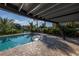 Inviting swimming pool with a relaxing patio area at 12404 Capri N Cir # 0, Treasure Island, FL 33706