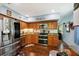 Modern kitchen with stainless steel appliances and wood cabinets at 2430 Brazilia Dr # 24, Clearwater, FL 33763
