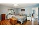 Primary bedroom with king bed, dresser, and light blue walls at 2430 Brazilia Dr # 24, Clearwater, FL 33763