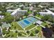 Community tennis courts, shuffleboard, and clubhouse at 2430 Brazilia Dr # 24, Clearwater, FL 33763