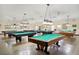 Game room with many billiard tables available for residents at 2430 Brazilia Dr # 24, Clearwater, FL 33763