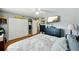 Bright bedroom with king-size bed and ample closet space at 2430 Brazilia Dr # 24, Clearwater, FL 33763