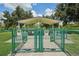 Fenced-in dog park with separate sections for small and large breeds at 2430 Brazilia Dr # 24, Clearwater, FL 33763